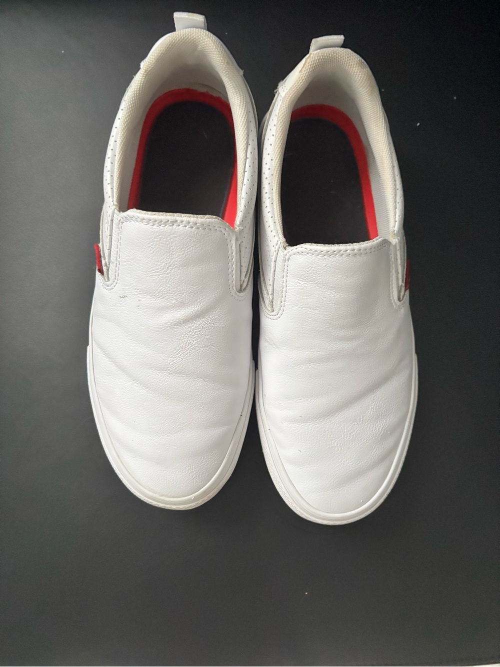 Levi’s Women’s White Slip-On Casual Sneakers with Red Accent